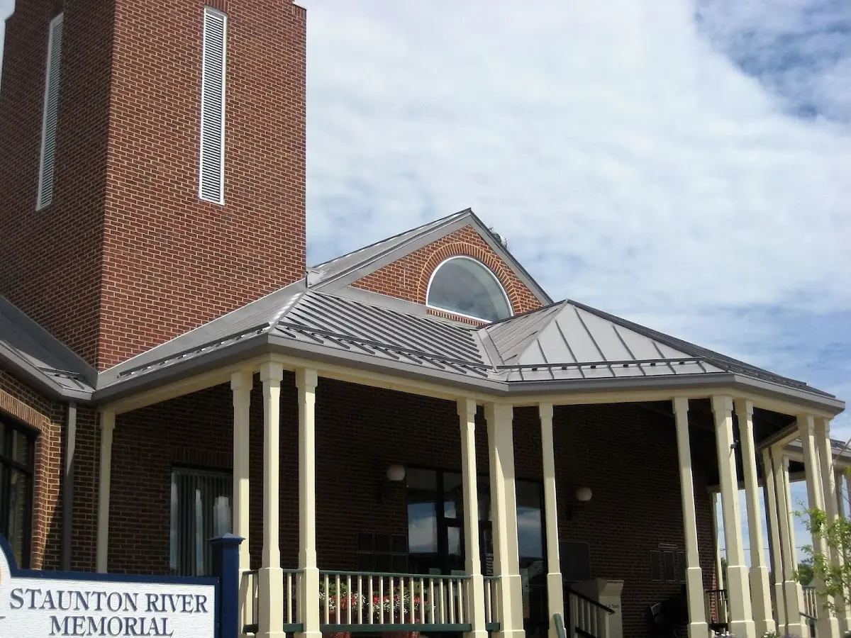 Skilled roofing craftsmen working on a residential roof in Oriskany